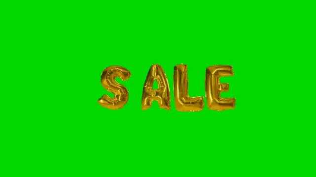 Golden balloon letters spelling 'SALE' on a vibrant green screen background, perfect for promotional content.