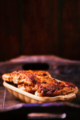  Fried chicken breast with potatoes. Rustic wooden background. Soft focus.