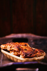  Fried chicken breast with potatoes. Rustic wooden background. Soft focus.