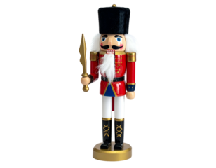Wooden toy soldier nutcracker in a uniform, gold details, black background