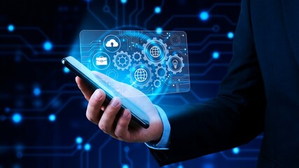 Businessman Holding Smartphone with Digital Gear Icons for Tech Industry Banner