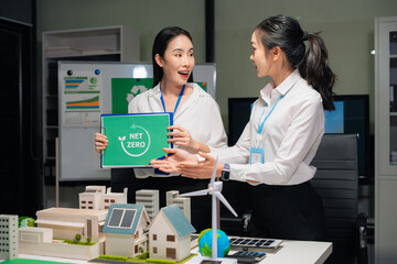 Two colleagues discussing data Construction Site project, green energy and solar panel concept.