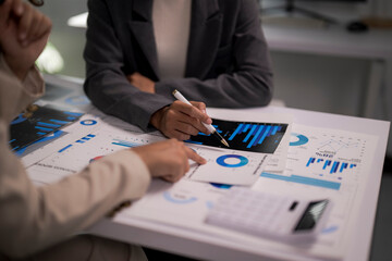 Business people analyzing financial report data charts