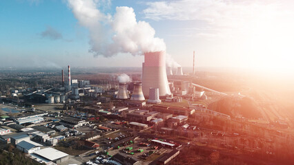 Smokestacks releasing steam into the environment