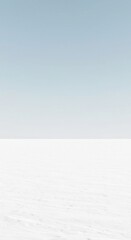 A pure, boundless white expanse stretching to the horizon, perfect for limitless copy space, representing possibility and absence, clarity, foundation, vast