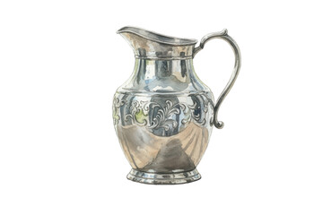 Elegant Silver Pitcher Displaying Ornate Design Isolated Against a Dark Surface.