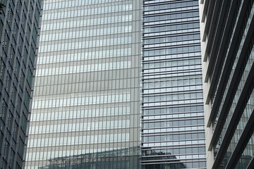 Detailed perspective of the weathered underside of a blue steel bridge