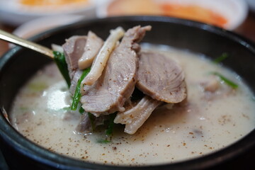 Hearty Korean Sundae-guk (blood sausage soup) with rice in a hot stone pot