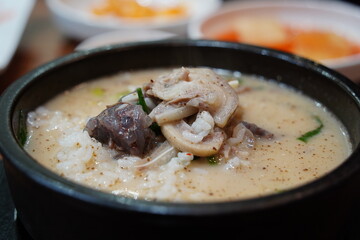 Hearty Korean Sundae-guk (blood sausage soup) with rice in a hot stone pot