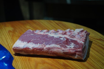 Fresh raw pork belly slices for cooking, perfect for Korean barbecue or roasting