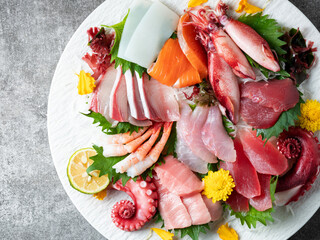 A variety of raw fish and seafood on a plate
