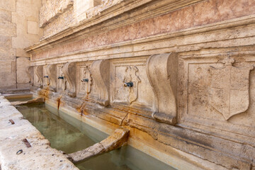 Fonte Oliviera (Oliviera Fountain), 16th century fountain, wall decorated with coats of arms, Assisi, Italy