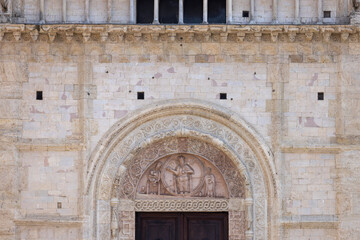 Decorative facade with main entrace to romanesque 12th century Assisi Cathedral, Assisi, Italy