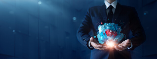 Businessman holding abstract cube of Ai technology. Highly competitive business, strategy changes are essential to gain a competitive advantage. Technology as a planning tool is therefore crucial.