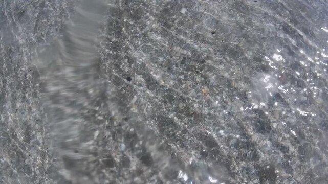 Blue water with rays of sunlight illuminating underwater. Footage taken by a go pro. Summer time in New Zealand.