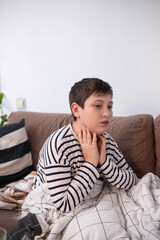 Sick boy touching neck unwell coughing with sore throat pain,bronchitis,Bronchial Asthma,Tuberculosis,pneumonia,covid-19,eco air pollution pm2.5.insurance and hospital