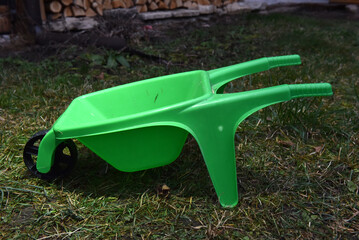 Green plastic wheelbarrow