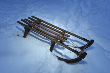 Wooden sled in snow