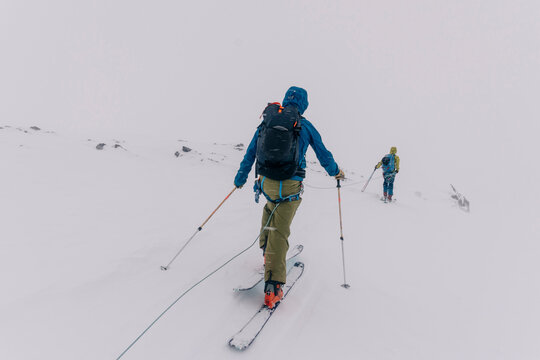 Skiers travel over glaciers in the backcountry of Canada.
