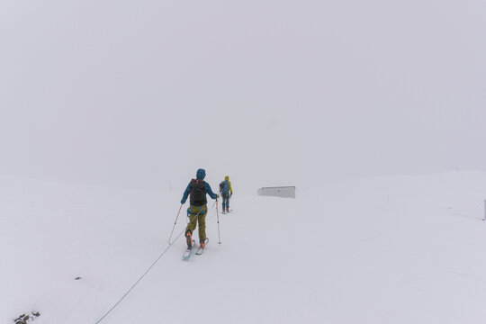 Skiers travel over glaciers in the backcountry of Canada.