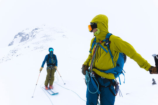 Skiers travel over glaciers in the backcountry of Canada.