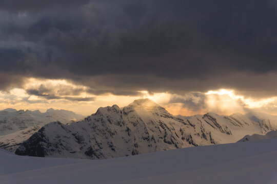 Sun sets over mountains in the Northern Rockies of Canada.