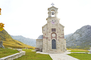 Mountain autumn landscape with the Church of Saint Ilija on the Lukavica plateau. Represents spiritual retreat, Balkan Orthodox tradition, cultural heritage, and harmony between faith and nature.