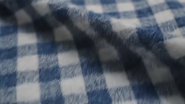 Blue and white checkered fabric texture close-up