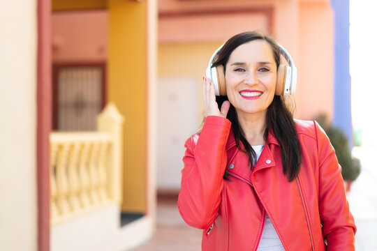 Middle aged woman listening music