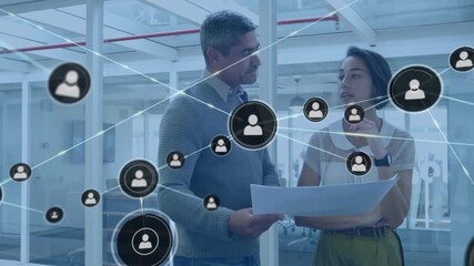 Animation of network of connections with people icons over diverse business people in office - Powered by Adobe
