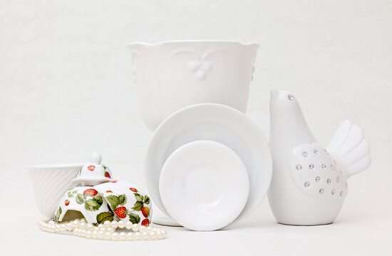 White different porcelain items on white background