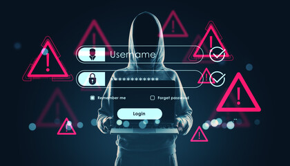 Hacker in hoodie holding laptop with digital login overlay and warning signs on dark background symbolizing cybercrime and online security threats.