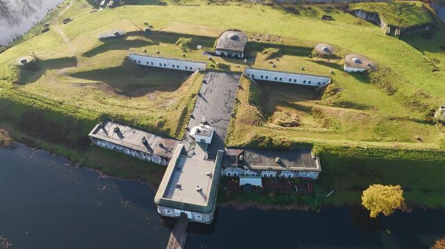 fort liezele military fortifications surrounded by water puurs belgium fort's structure within scenic downward aerial drone panning shot view impressive context visual delight 