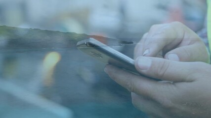 Animation of hands of caucasian man using smartphone over seascape - Powered by Adobe