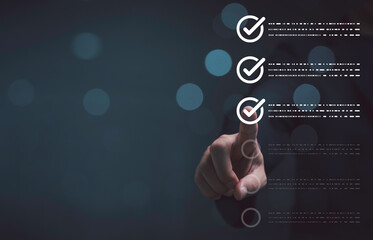 Businessman hand touching virtual checkmark to checklist showing task completion ,workflow process control quality assurance and digital approval management system concept.