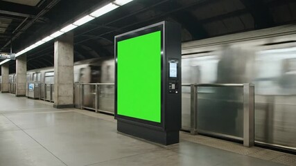 A subway station scene featuring a green screen advertisement panel with a blurred train passing by. - Powered by Adobe