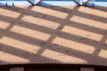 indoor brick wall and glass roof window sun pattern of shadow cells contrast light view mock up background
