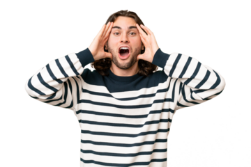 Young handsome man over isolated background with surprise expression