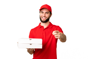 pizza delivery man with work uniform picking up pizza boxes over isolated chroma key background pointing front with happy expression