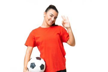 Young beauty woman over isolated chroma key background with soccer ball and making OK sign