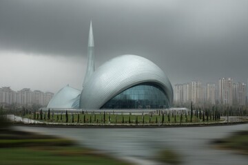 Obraz premium Modern architectural building with a domed structure against a cloudy sky.