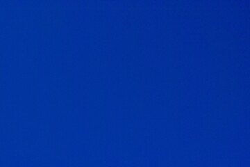 Empty blue sky texture background, full-frame real photograph.