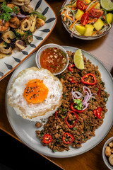 Pad Kra Pao Pork and Holy Basil Stir fry traditional thai food meal on table at restaurant in phuket thailand