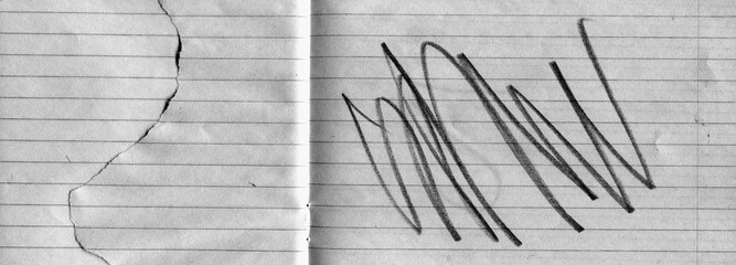 Lined notebook paper texture with fold crease, torn edge and black expressive pencil marks. Minimal yet emotional background combining stationery surface with abstract gesture and contrast