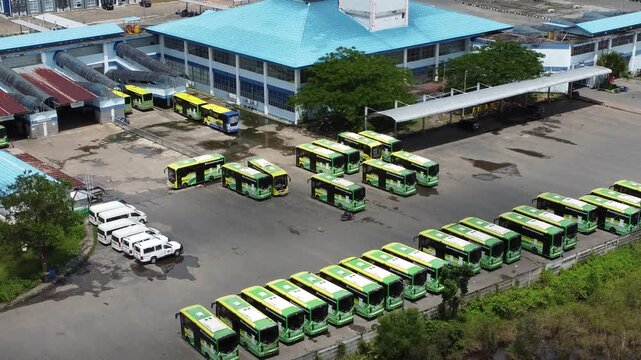 View of buses parked in a row at the bus terminal