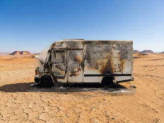 The damaged vehicle and harsh environment create a dramatic post-apocalyptic scene symbolizing failure, abandonment, climate extremes, and isolation.