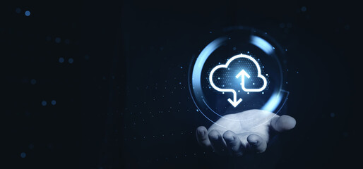Hand holding glowing cloud icon with upload and download arrows, symbolizing digital cloud storage concept on futuristic technology background.