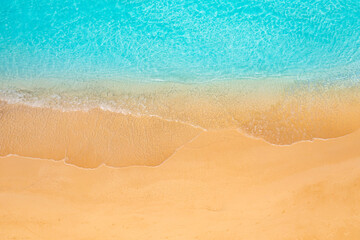 Pristine tropical Mediterranean beach aerial view with calm ocean waves white sand coastline top perspective relaxing summer vacation tropical island paradise serene nature landscape travel background