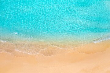 Pristine tropical Mediterranean beach aerial view with calm ocean waves white sand coastline top perspective relaxing summer vacation tropical island paradise serene nature landscape travel background