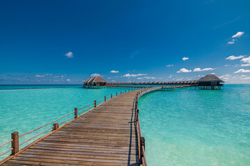 Tropical Maldives water villa wooden pier over pristine turquoise ocean lagoon aerial view luxury resort summer vacation travel destination paradise tropical island serene beach landscape background